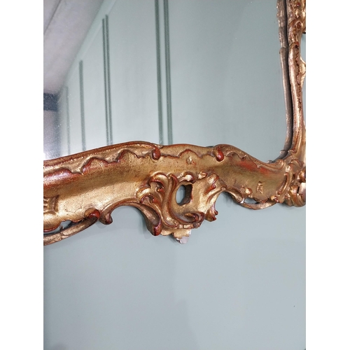 62 - Decorative giltwood wall mirror in the Rococo style {105 cm H x 70 cm W}. U