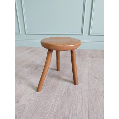 63 - 19th C. Irish painted elm three legged stool {31 cm H x 33 cm Dia.}.