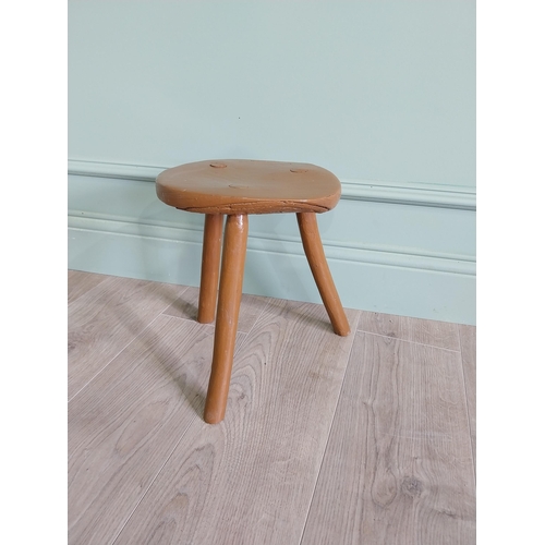 63 - 19th C. Irish painted elm three legged stool {31 cm H x 33 cm Dia.}.