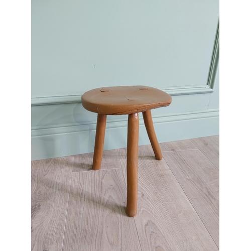 63 - 19th C. Irish painted elm three legged stool {31 cm H x 33 cm Dia.}.