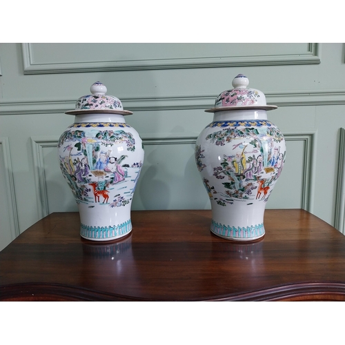 73 - Pair of decorative Oriental ceramic lidded urns {42 cm H x 22 cm Dia.}.