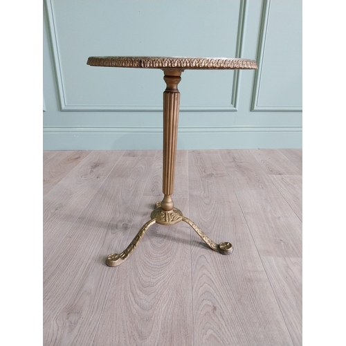 903 - Gilded metal wine table with faux marble centre raised on reeded column and three outswept legs {50 ... 