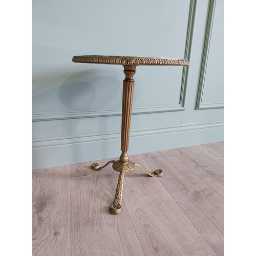 903 - Gilded metal wine table with faux marble centre raised on reeded column and three outswept legs {50 ... 