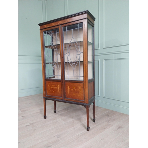 905 - Edwardian mahogany and satinwood display cabinet with two leaded glass doors raised on square tapere... 