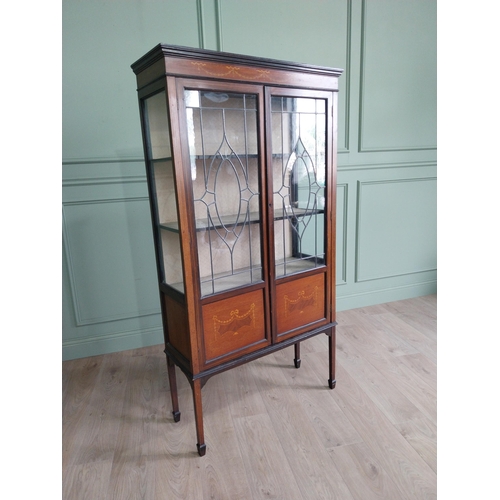 905 - Edwardian mahogany and satinwood display cabinet with two leaded glass doors raised on square tapere... 