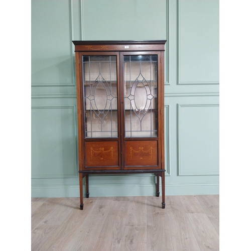 905 - Edwardian mahogany and satinwood display cabinet with two leaded glass doors raised on square tapere... 