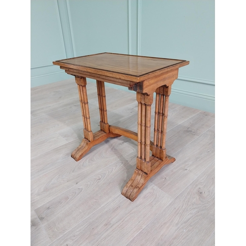 93 - 19th C. satinwood nest of three tables raised on turned legs {56 cm H x 36 cm W x 44 cm D}.