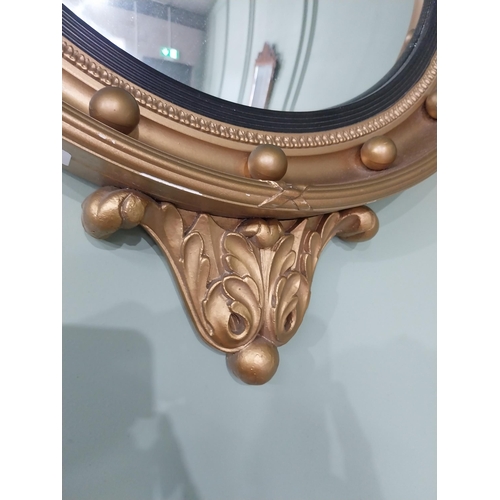 97 - Gilt convex mirror in the Regency style {70 cm H x 47 cm Dia.}.