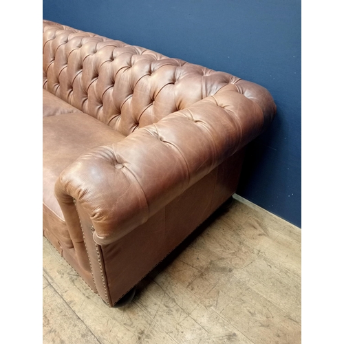 231 - Good quality deep button leather upholstered Chesterfield sofa raised on bun feet {H 70cm x W 198cm ... 