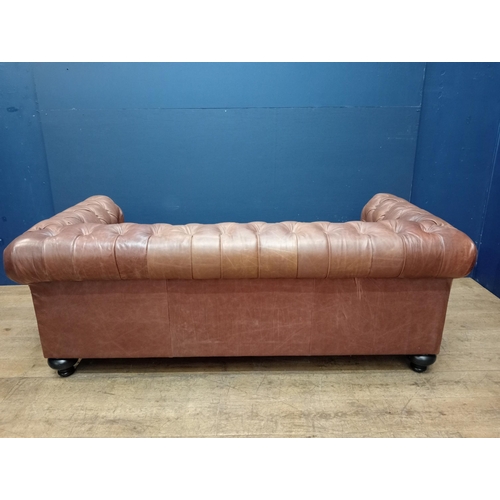 231 - Good quality deep button leather upholstered Chesterfield sofa raised on bun feet {H 70cm x W 198cm ... 