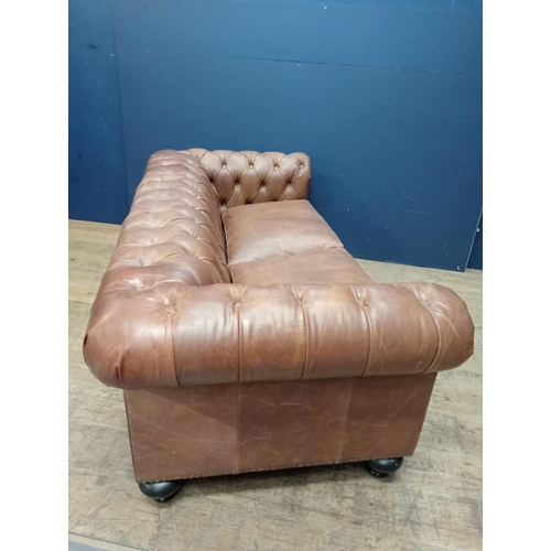 231 - Good quality deep button leather upholstered Chesterfield sofa raised on bun feet {H 70cm x W 198cm ... 