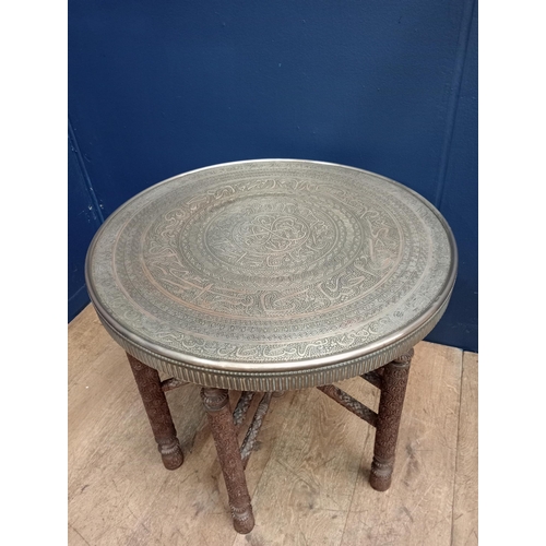 72 - Brass and wood Anglo, Indian, Arabic carved folding end table {H 500cm x Dia 60cm }. - NOT AVAILABLE... 