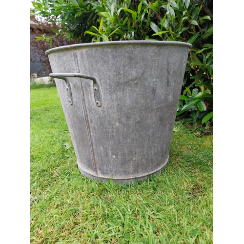 1116 - Pair of early 20th C. galvanised planters {39 cm H x 43 cm Dia.}.