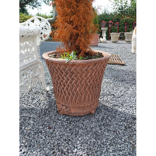 1305 - Pair of moulded terracotta lattice planters {143 cm H - including and Planter 50 cm H x 55 cm Dia.}.