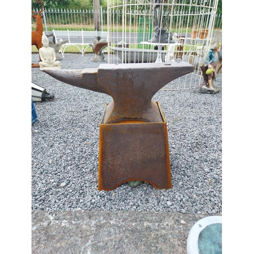 1320 - Large Anvil mounted on stand {75 cm H x 84 cm W x 36 cm D}.