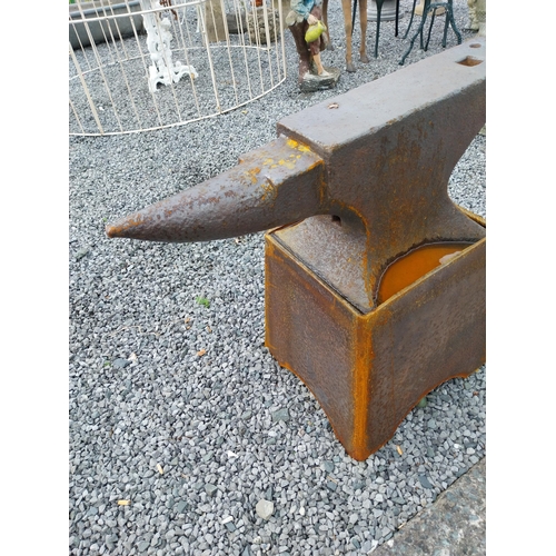 1320 - Large Anvil mounted on stand {75 cm H x 84 cm W x 36 cm D}.