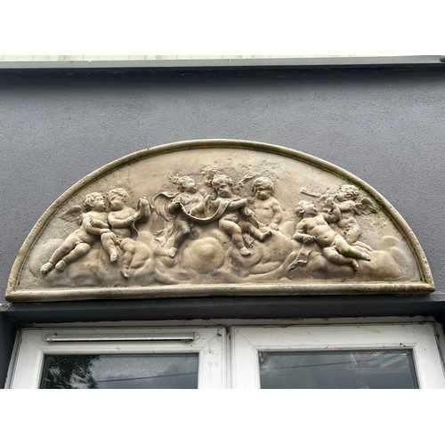 1312 - Good quality moulded sandstone wall plaques decorated with cherubs {50cm H x 116cm W}