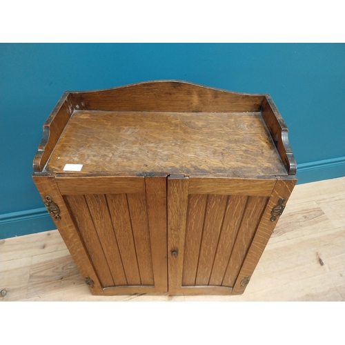356 - Edwardian oak wall hanging office cabinet with fitted interior. {73 cm H x 58 cm W  x 29 cm D}