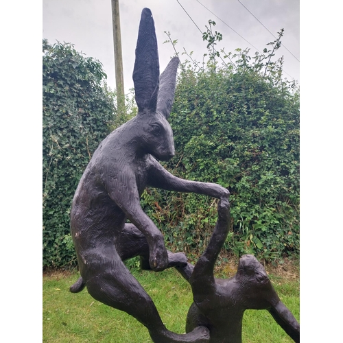 1337 - Exceptional quality bronze sculpture of Fighting Hares {160 cm H x 32 cm W  x 30 cm D}.