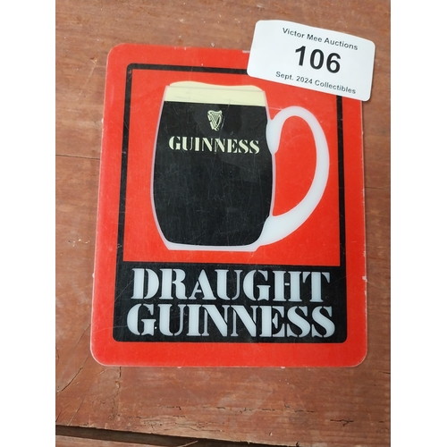 106 - Draught Guinness Counter celluloid advertising sign {15 cm H x 13 cm W}.