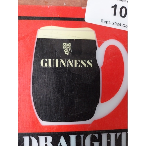 106 - Draught Guinness Counter celluloid advertising sign {15 cm H x 13 cm W}.