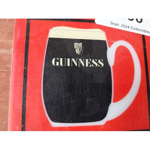 106 - Draught Guinness Counter celluloid advertising sign {15 cm H x 13 cm W}.