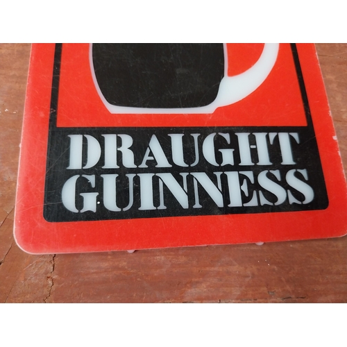 106 - Draught Guinness Counter celluloid advertising sign {15 cm H x 13 cm W}.