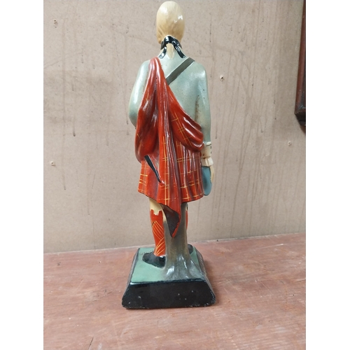 112 - Drambuie rubberoid advertising figure. {34 cm H x 11 cm W x 11 cm D}.