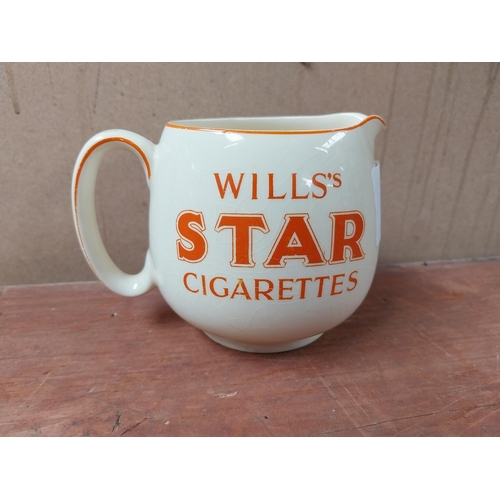 114 - Wills's Star Cigarettes ceramic advertising jug. {10 cm H x 15 cm W x 10 cm D}.