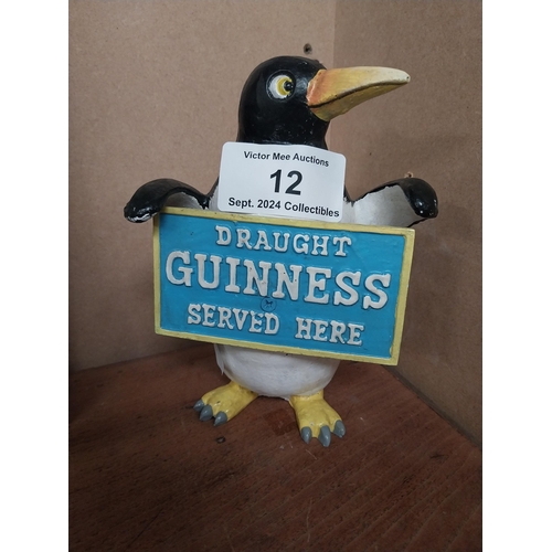 12 - Guinness advertising model of Penguin. {22 cm H x 16 cm W x 9 cm D}.