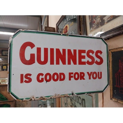 1236 - Guinness sold here double sided enamel bracket advertising sign. {28 cm Hx  46 cm W}.