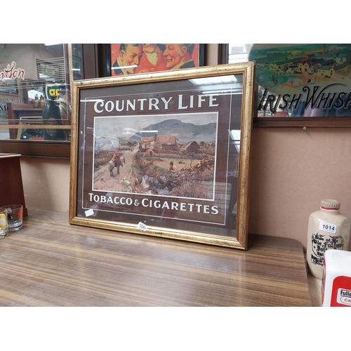 1241 - Player's Country Life Tobacco and Cigarettes framed showcard. {55 cm H x 67 cm W}.