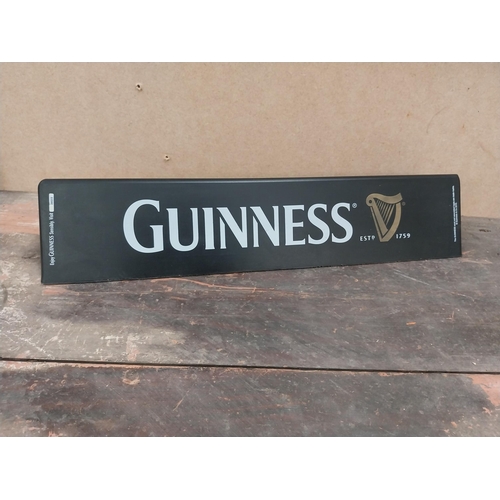 1252 - Two Guinness counter signs {9 cm H x 44 cm W} and four Guinness Rugby advertising signs. {24 cm H x ... 