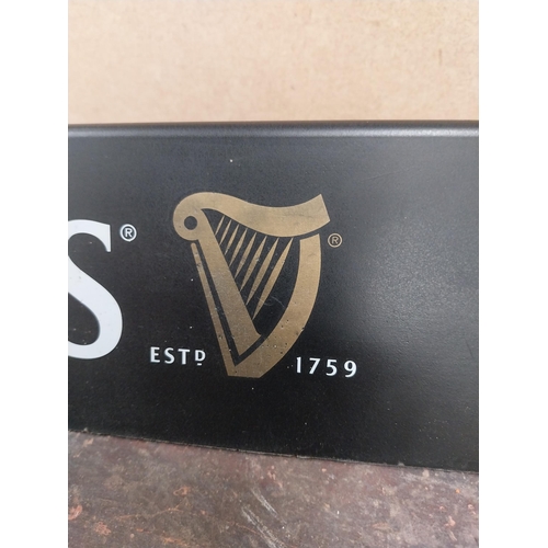 1252 - Two Guinness counter signs {9 cm H x 44 cm W} and four Guinness Rugby advertising signs. {24 cm H x ... 