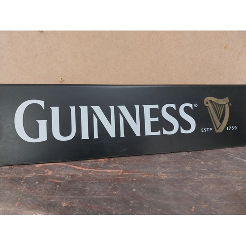 1252 - Two Guinness counter signs {9 cm H x 44 cm W} and four Guinness Rugby advertising signs. {24 cm H x ... 