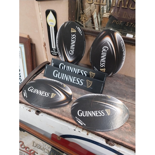 1252 - Two Guinness counter signs {9 cm H x 44 cm W} and four Guinness Rugby advertising signs. {24 cm H x ... 