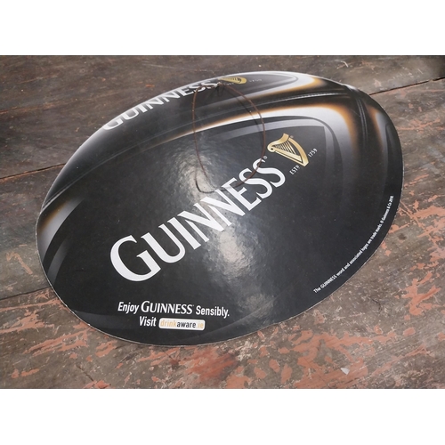 1252 - Two Guinness counter signs {9 cm H x 44 cm W} and four Guinness Rugby advertising signs. {24 cm H x ... 