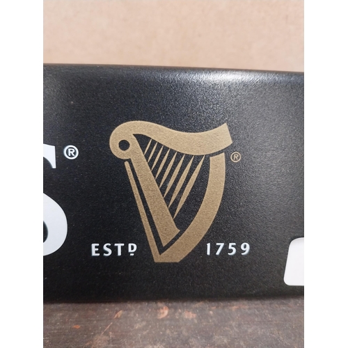 1252 - Two Guinness counter signs {9 cm H x 44 cm W} and four Guinness Rugby advertising signs. {24 cm H x ... 