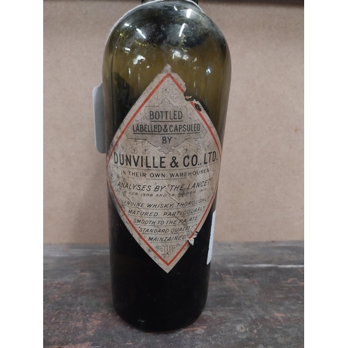 1253 - Bottle of Dunvilles V R Old Irish Whiskey. (partial contents}