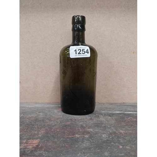 1254 - Findlater Dublin rolled top half pint advertising bottle. {19 cm H x 8 cm W x 5 cm D}