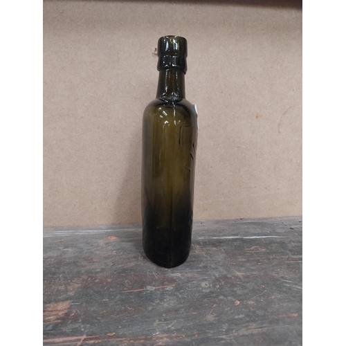 1254 - Findlater Dublin rolled top half pint advertising bottle. {19 cm H x 8 cm W x 5 cm D}