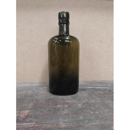 1254 - Findlater Dublin rolled top half pint advertising bottle. {19 cm H x 8 cm W x 5 cm D}