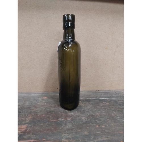 1254 - Findlater Dublin rolled top half pint advertising bottle. {19 cm H x 8 cm W x 5 cm D}