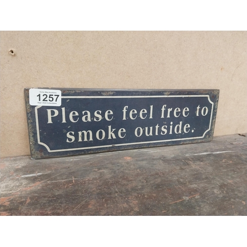 1257 - Please feel free to smoke outside tinplate sign. {10 cm H x 41 cm W}.