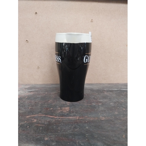 1259 - Guinness Draught ceramic advertising jug. {16 cm H x 15 cm W x 8 cm D}.