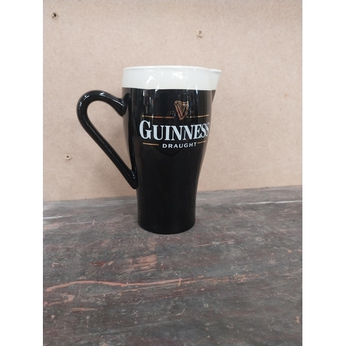 1259 - Guinness Draught ceramic advertising jug. {16 cm H x 15 cm W x 8 cm D}.