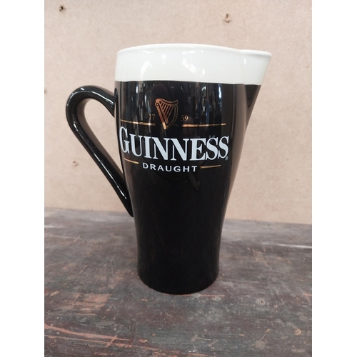 1259 - Guinness Draught ceramic advertising jug. {16 cm H x 15 cm W x 8 cm D}.