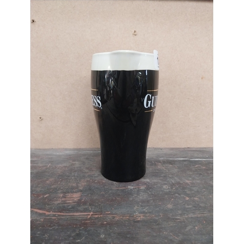 1259 - Guinness Draught ceramic advertising jug. {16 cm H x 15 cm W x 8 cm D}.