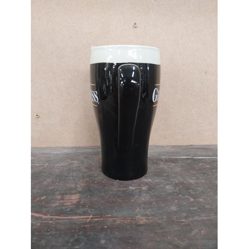 1259 - Guinness Draught ceramic advertising jug. {16 cm H x 15 cm W x 8 cm D}.