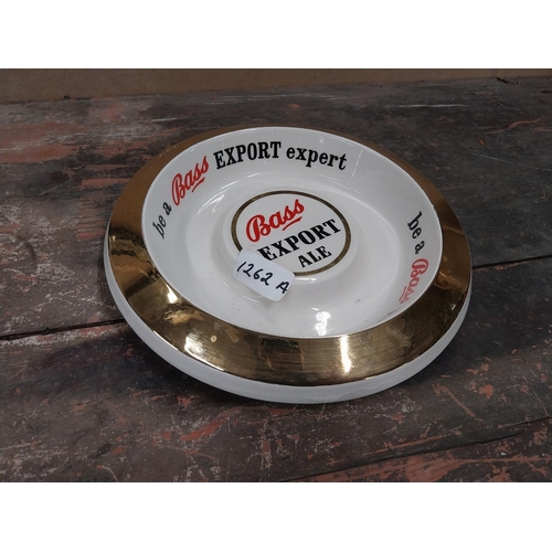 1262A - Be a Bass Expert Wade ceramic advertising ashtray. {4 cm H x 24 cm Dia.}.